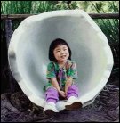 Zia in an egg sculpture.